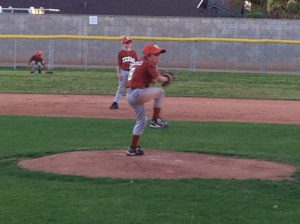 Kids Shoulder Pain- picture of a left handed pitcher ready to throw the ball