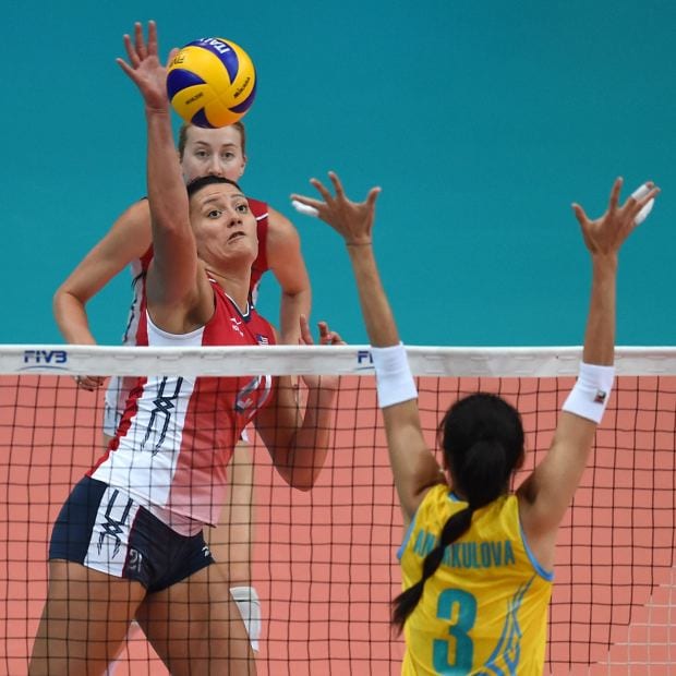 Volleyball Knee Injuries: Tori Dixon of USA Volleyball hits at the net in a match