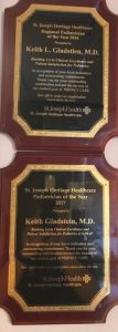 Best Pediatrician Award: 2 plaques celebrating Dr. Keith Gladstien winning 2 years in a row