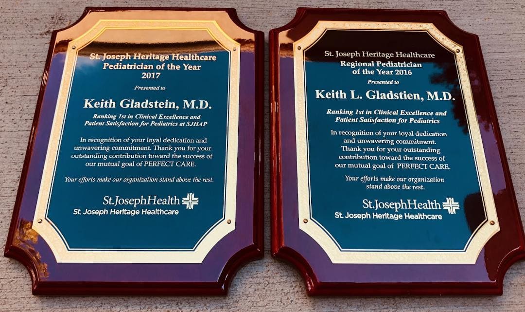 Best Pediatrician Award: Picture of 2 Plaques Celebrating Dr. Gladstien winning in back to back years