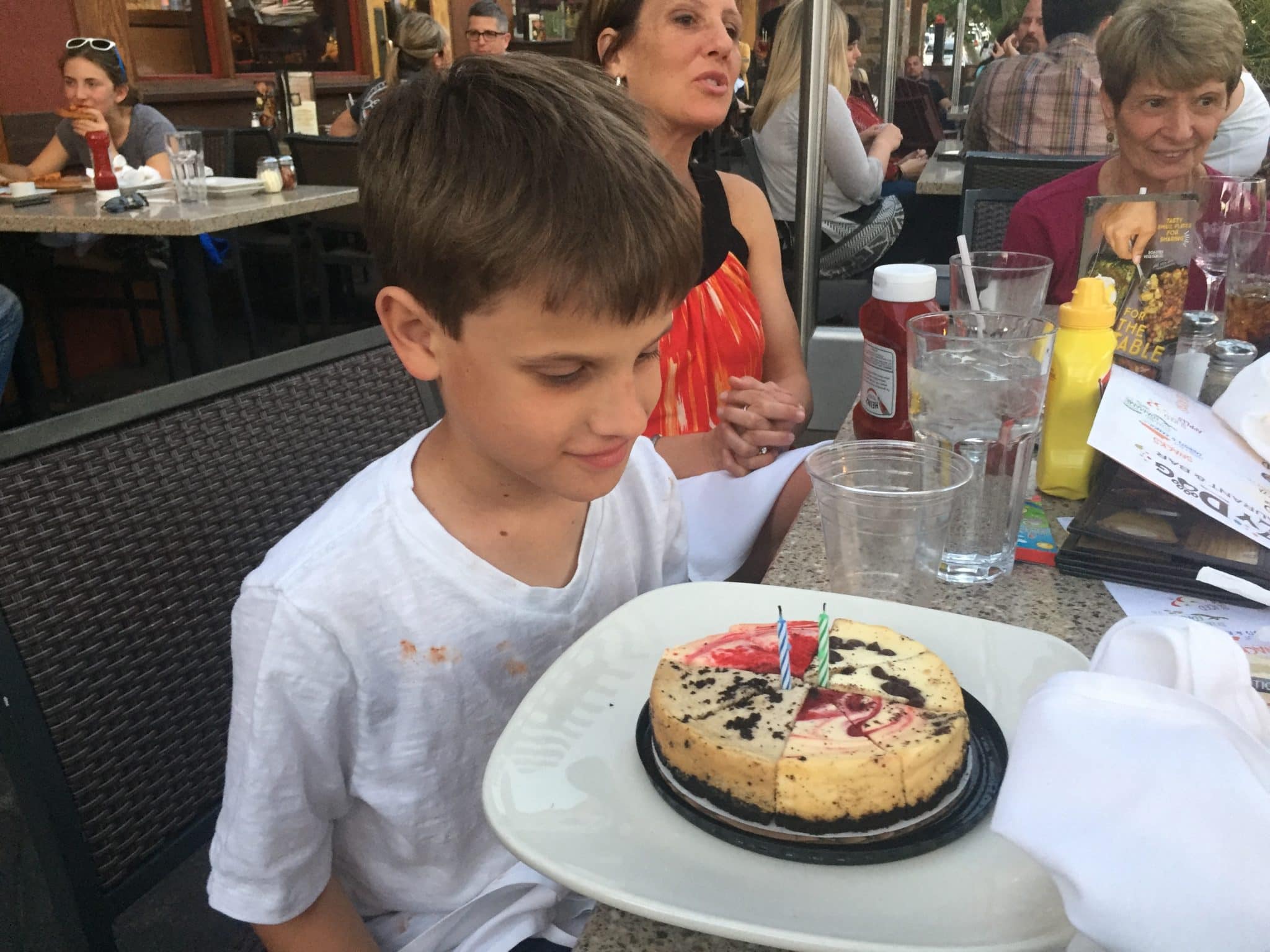 Sports Schedules: Picture of Young Boy looking at his birthday cake