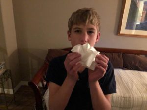 Colds: Picture of young boy blowing his nose